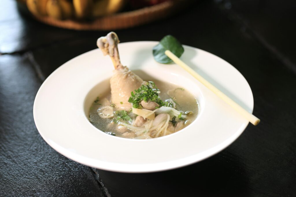Delicious Cambodian chicken soup with lemongrass, showcasing an exotic blend of flavors.
