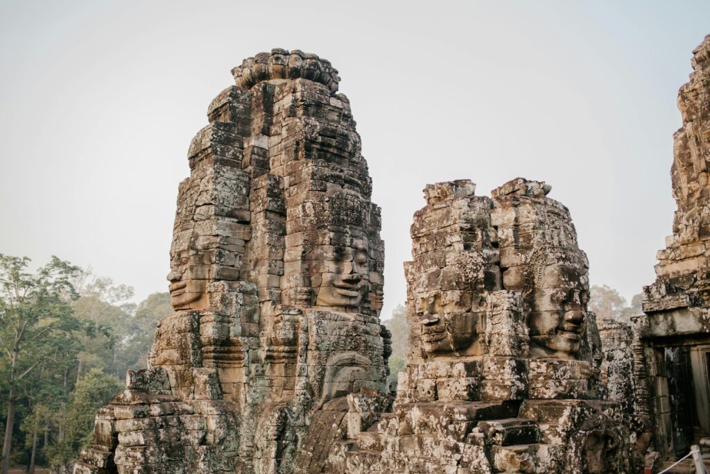 pexels-photo-5769405-5769405 Ancient stone faces of Bayon Temple, a historic Khmer landmark in Cambodia.